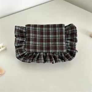 Retro plaid cosmetic bag featuring stylish ruffled edges, perfect for daily storage or evening use.