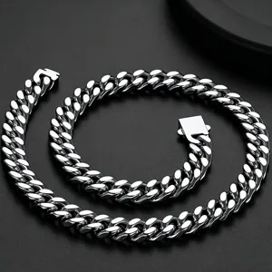 Detail view of a sleek silver titanium steel Cuban link chain necklace with polished finish.
