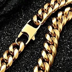 Gold stainless steel Cuban link chain necklace detail showing heavy metal link texture and clasp.