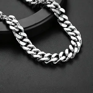 Close-up detail shot of a chunky stainless steel Miami Cuban link chain with polished finish.