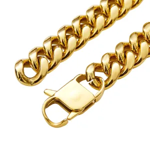 Gold cuban link chain necklace detail close-up showing clasp and metallic polished texture.