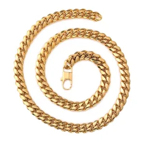 Gold tone Cuban link chain necklace detail view, classic thick metal curb chain with lobster clasp.