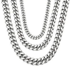 Detailed close-up of silver stainless steel Cuban link chains, showcasing high polished finish.