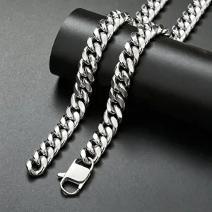 Detailed close-up view of the polished silver stainless steel Cuban link chain necklace clasp.