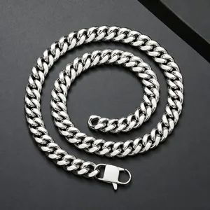Stainless steel cuban link chain necklace detail with polished silver metal links and secure clasp.