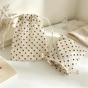 Sheer polka dot mesh drawstring storage bag, portable toiletry pouch for daily organization.