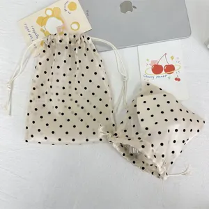 Champagne dot drawstring mesh storage bag, portable large capacity pouch for travel cosmetics.