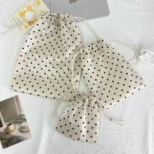 Champagne polka dot drawstring storage bag set, lightweight pouch for cosmetics and daily travel.