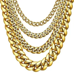 Detailed close-up of layered gold Cuban link chains, showing fine metal texture and links.