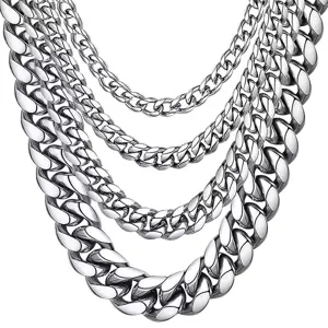 Detailed close-up view showcasing multiple silver stainless steel cuban link chains stacked.