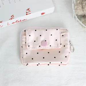 Pink polka dot coin purse with flap closure, cute mini portable card holder storage bag.