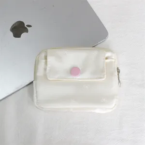 Mini bow print coin purse with flap and snap button, portable card holder and storage bag.