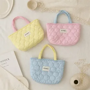 Korean style quilted tote bag detail shot, soft cotton daily handbag with contrast handles.