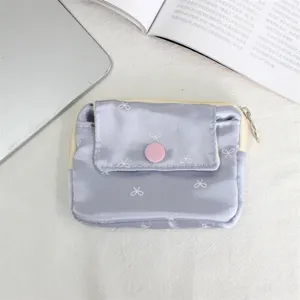 Mini purple bow print canvas coin purse with snap button and zipper closure for daily use.