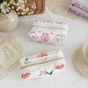 Cute aesthetic makeup pouch with lace trim and bow, perfect student pencil case and storage bag.