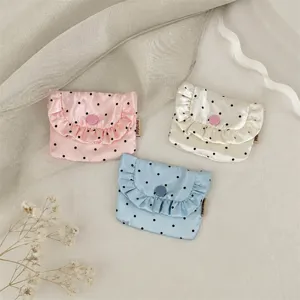 Korean satin coin pouch detail showcasing cute polka dot print, sweet ruffles and cute button.