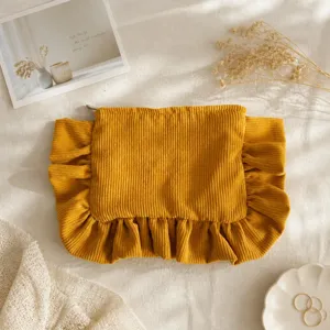 Solid color corduroy ruffled cosmetic bag, portable large capacity cute clutch storage bag.