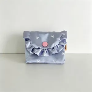 Korean satin ruffled flap coin purse featuring cute bow print and pink snap buttons.