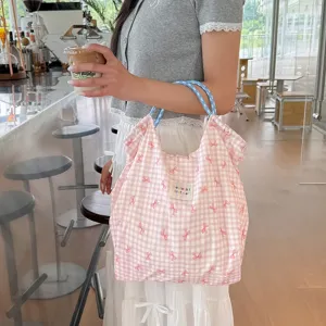 Sac cabas fourre-tout coréen d'été avec motif à carreaux roses, nœuds et cordon de serrage.