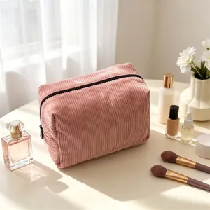 Pink corduroy cosmetic bag with large capacity, perfect for travel and daily use.
