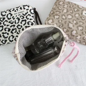 Leopard print canvas cosmetic pouch zipper makeup bag detail view with inner lining features