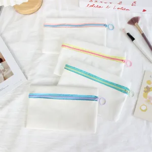Canvas zipper pencil case in white with colorful zippers, versatile portable pouch detail view.