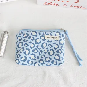 Blue leopard print zipper coin purse with wrist strap and brand tag, compact daily storage pouch.