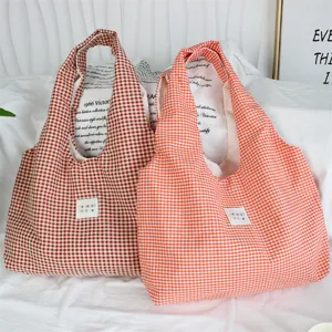 Casual plaid canvas tote bag, large capacity shoulder bag for daily commuting and casual use.