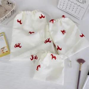 Detail shot of Korean style embroidered horse drawstring dust-proof pouch set for home travel.