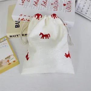 Korean embroidered pony drawstring bag detail, ideal for cosmetics travel sorting and storage.