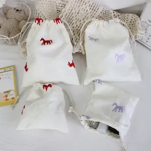 Detailed view of Korean style embroidered pony drawstring storage bags, ideal for cosmetics.