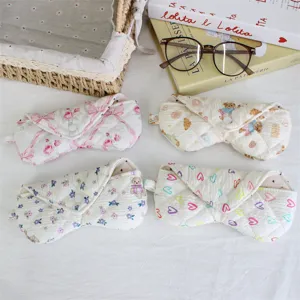 Cute quilted glasses storage pouch featuring floral and bear patterns, soft fabric dust bag.
