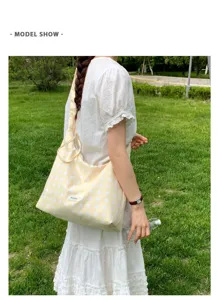Yellow polka dot canvas shoulder bag for women, casual minimalist underarm bag with strap.