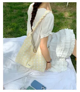 Yellow polka dot shoulder bag for women, large capacity with adjustable strap, casual crossbody bag.