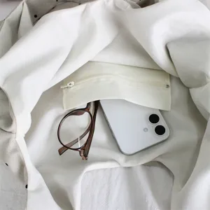 Detailed view of the interior capacity, featuring a soft lining and practical zipper pouch inside.