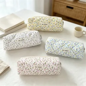 Quilted floral pencil case cosmetic bag large capacity stationery storage pouch with fabric label.