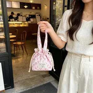 Cute floral corduroy handbag for women, portable casual bento pouch with convenient drawstring.