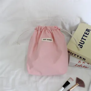 Roze trekkoord opbergtas detail, reis stofdichte zak, zachte draagbare make-up tas voor reizen.