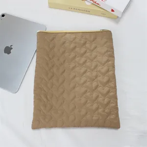 Quilted heart tablet sleeve for iPad, soft cute laptop storage pouch aesthetic case detail.