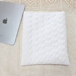 Quilted heart iPad sleeve detail view, soft white tablet storage pouch for daily cute aesthetic.