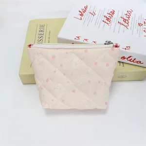 Cute quilted cosmetic bag with bunny and strawberry print, perfect portable makeup pouch zipper.