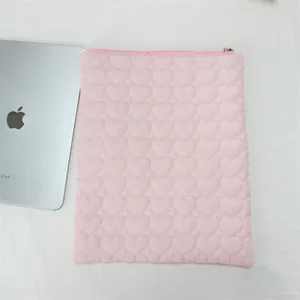 Pink quilted heart tablet sleeve detail shot, soft cute laptop storage pouch with zipper.