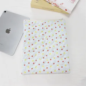 Quilted blue plaid iPad sleeve with cute strawberry and bear print, soft inner case.