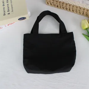 Solid black nylon mini tote bag, lightweight waterproof handbag, daily portable lunch bag.