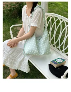 Light green polka dot hobo shoulder bag for women, casual slouchy stylish daily tote handbag.