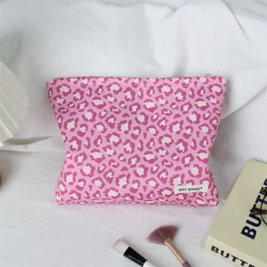 Trousse de maquillage rose imprimé léopard texture rétro pochette de rangement portable.