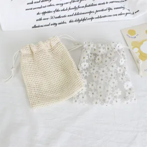 Daisy embroidered mesh drawstring storage bag for jewelry, cosmetics, and small gifts.