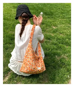 Floral hobo shoulder bag with gathered strap, stylish casual orange print handbag for daily use.