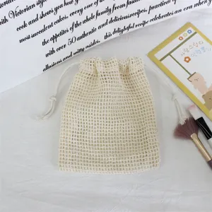 Mesh drawstring storage bag detail showing breathable white fabric for jewelry makeup organization.