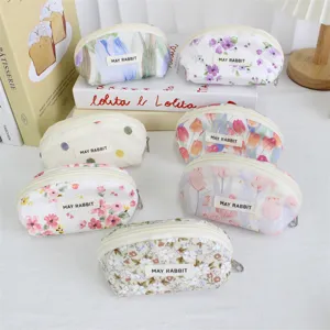 Cute floral shell cosmetic pouch detail, portable zipper makeup bag for women daily storage.